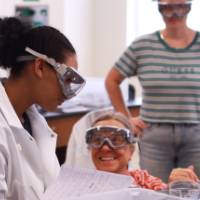 students interacting during a chemistry experiment